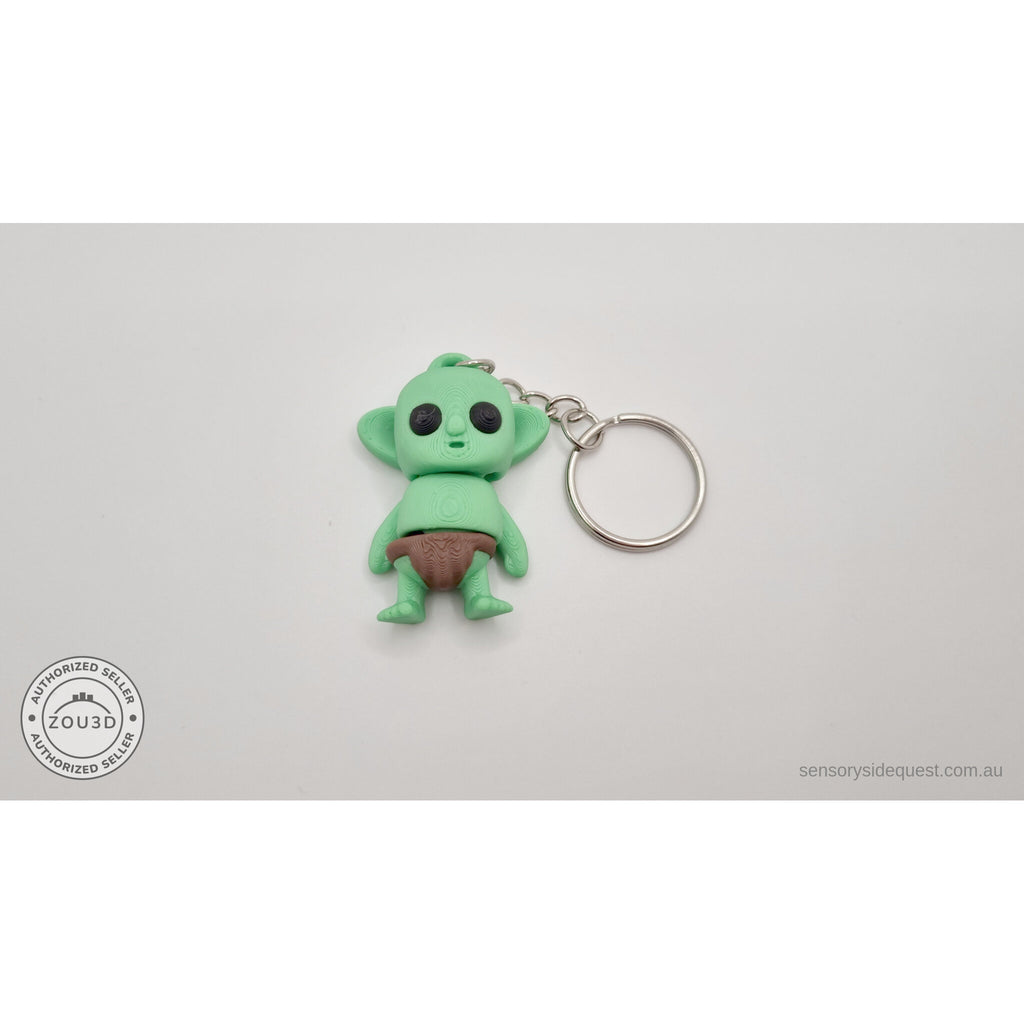 Tiny Goblin ZOU3D keychain flat lay — front-facing with silver keyring