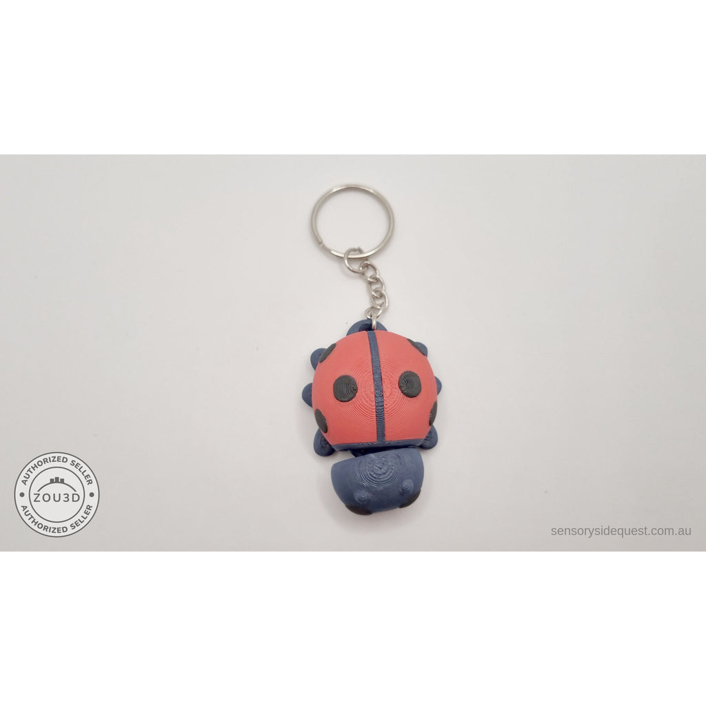 Baby Ladybug keychain — overhead view showing spotted elytra and keychain hardware