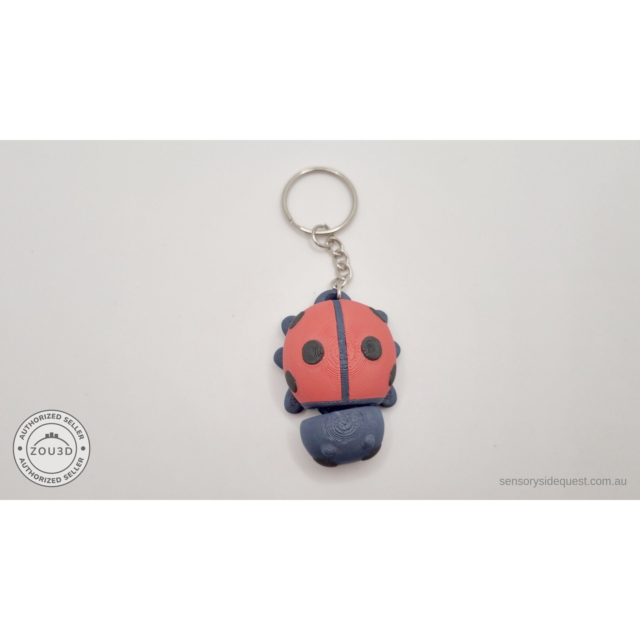 Baby Ladybug keychain — overhead view showing spotted elytra and keychain hardware