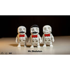 Mr.Skeleton 3D printed articulated fidget toy — official Zou3D × BIMo3D promo image showing all three variants: Moustache, Freddie Mercury, and Basic — white PLA with red bow ties against dark background