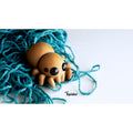 Sensory Sidequest Baby Spider 3D printed articulated fidget toy — sandy tan body with glossy black eyes, eight poseable legs, studio 3/4 front view on light background