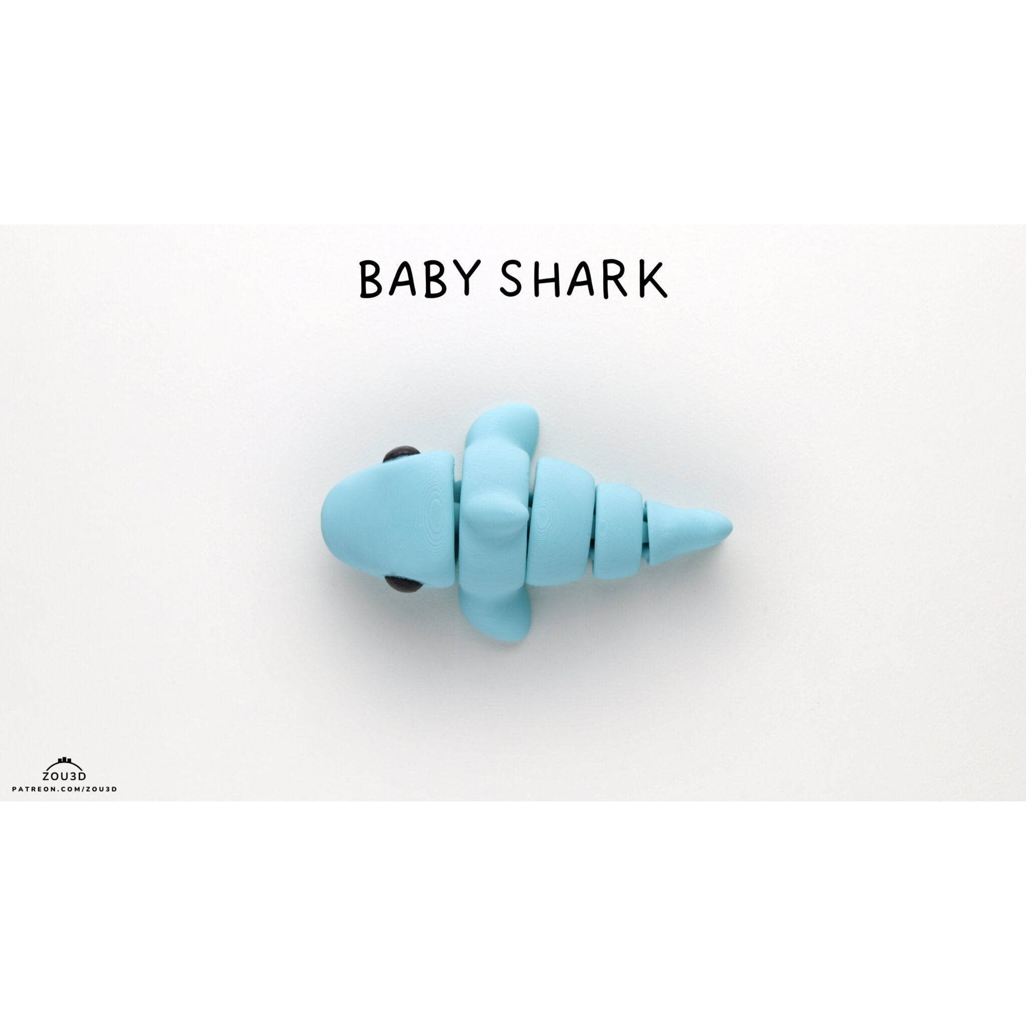 Zou3D Baby Shark articulated fidget toy — official stock render, 3/4 lying hero view with BABY SHARK title