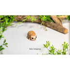 Sensory Sidequest Baby Hedgehog articulated 3D printed fidget toy — three-quarter front view showing full body and quill texture detail
