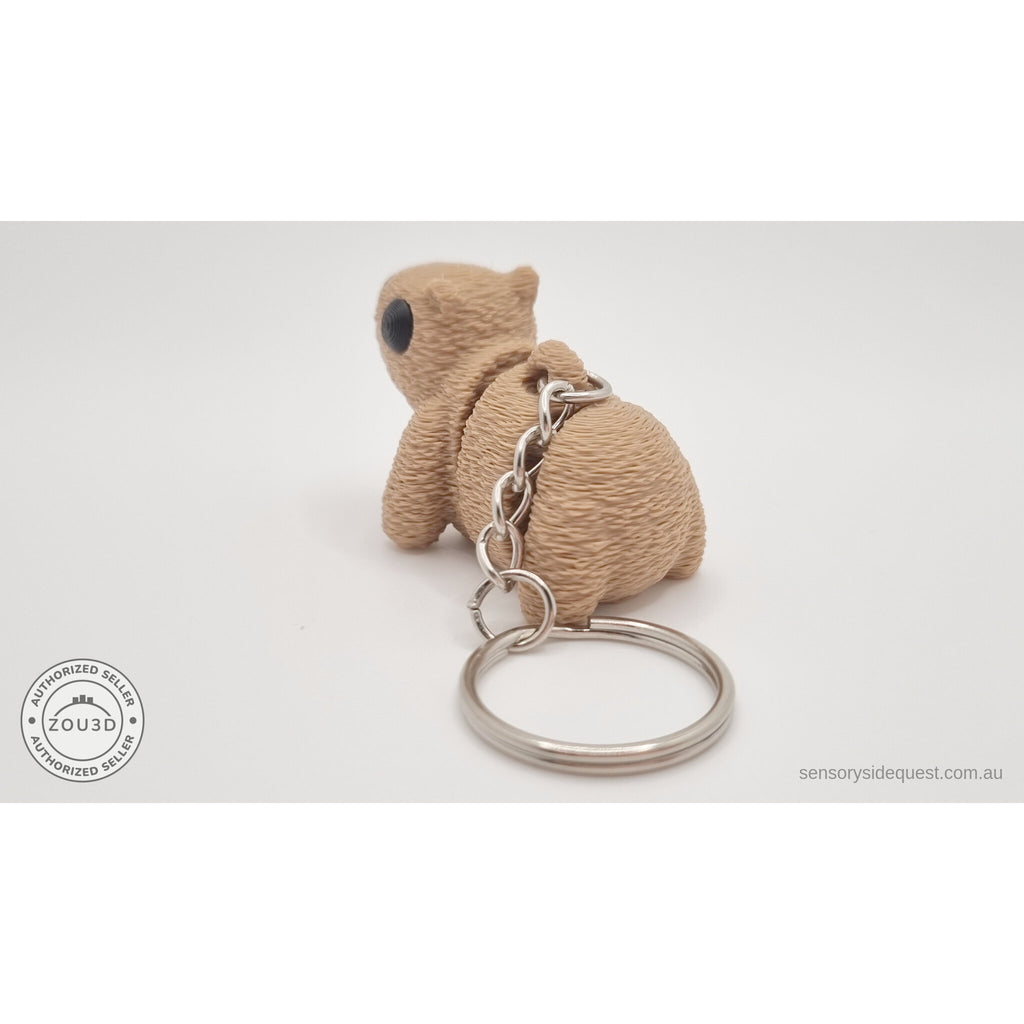 Baby Capybara fuzzy keychain — rear view showing texture detail and chain attachment