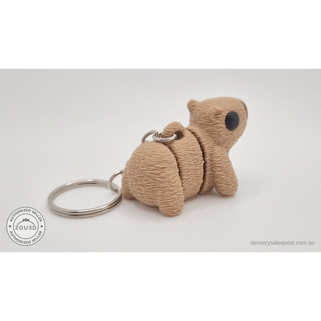 Baby Capybara fuzzy keychain — side view showing textured body with chain hardware