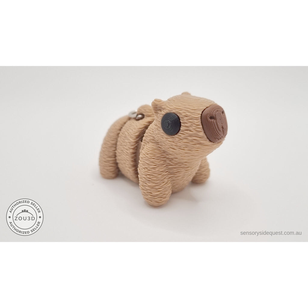 Baby Capybara fuzzy keychain — front angle showing textured body and expressive eye