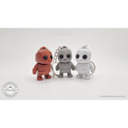 Tiny Rock Golem keychain collection — Red, Grey and White 3D printed keychains by Sensory Sidequest