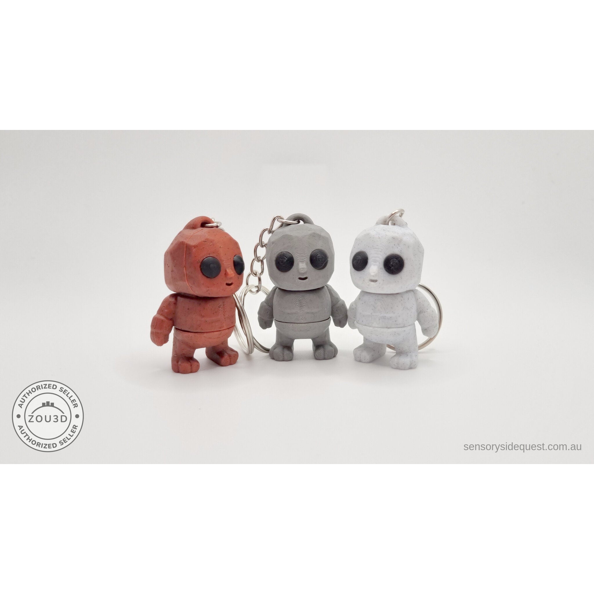 Tiny Rock Golem keychain collection — Red, Grey and White 3D printed keychains by Sensory Sidequest