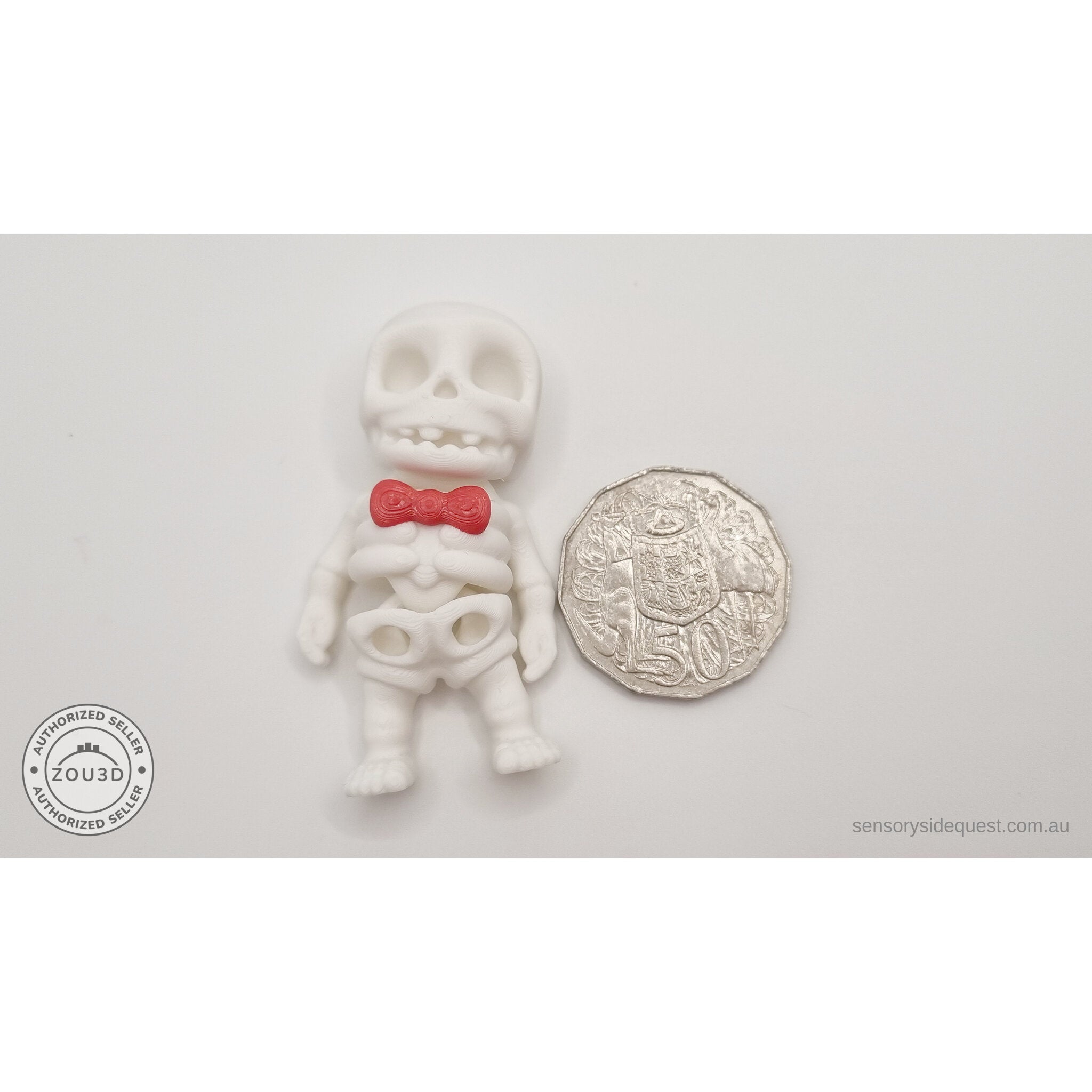 Mr.Skeleton Basic variant beside Australian 50 cent coin — scale reference showing compact palm-sized figure — 3D printed articulated fidget toy by Sensory Sidequest