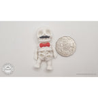Mr.Skeleton Moustache variant beside Australian 50 cent coin — scale reference showing dapper moustache detail at palm size — 3D printed articulated fidget toy by Sensory Sidequest