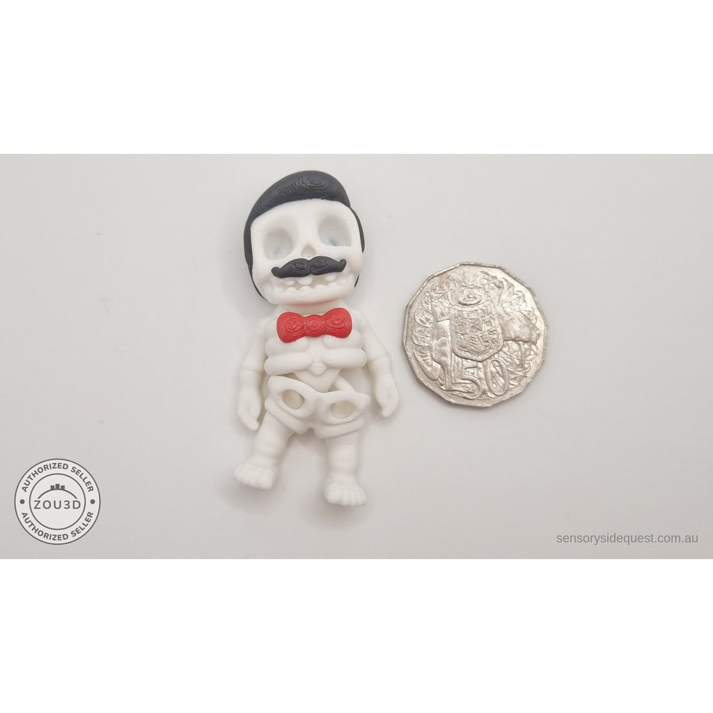 Mr.Skeleton Freddie Mercury variant beside Australian 50 cent coin — scale reference showing pompadour hair and moustache detail at palm size — 3D printed articulated fidget toy by Sensory Sidequest