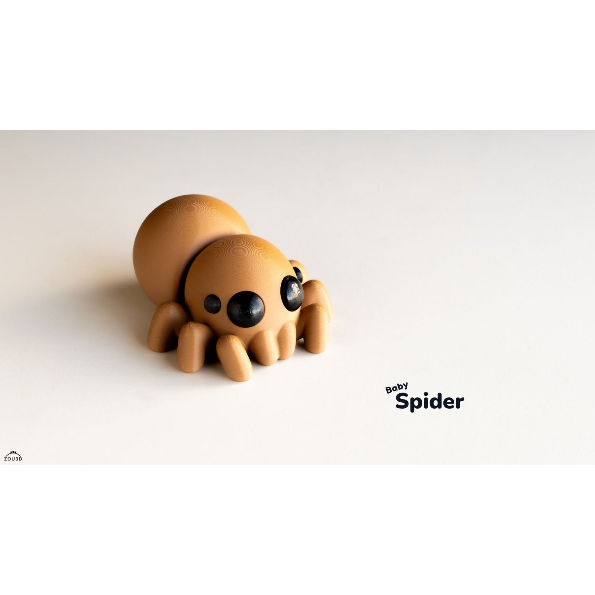 Zou3D Baby Spider 3D printed articulated toy nestled in teal yarn — front-facing view showing chibi face and eight legs