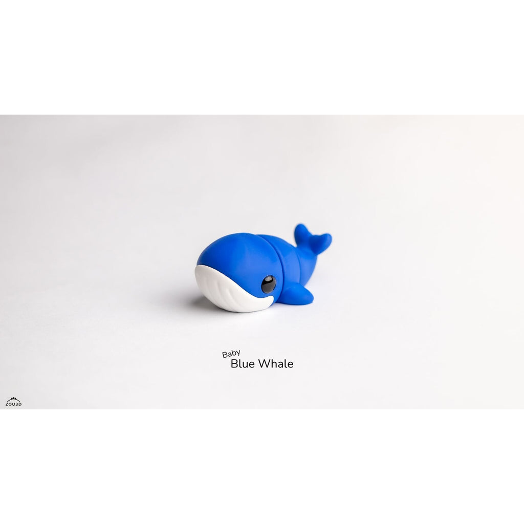 Baby Blue Whale Zou3D articulated toy — front-facing three-quarter angle showing expressive eye and blue body