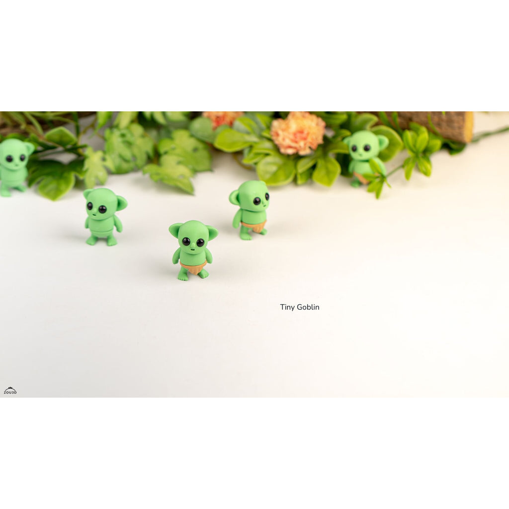 Green Tiny Goblin ZOU3D articulated toy — group of four figures with foliage background