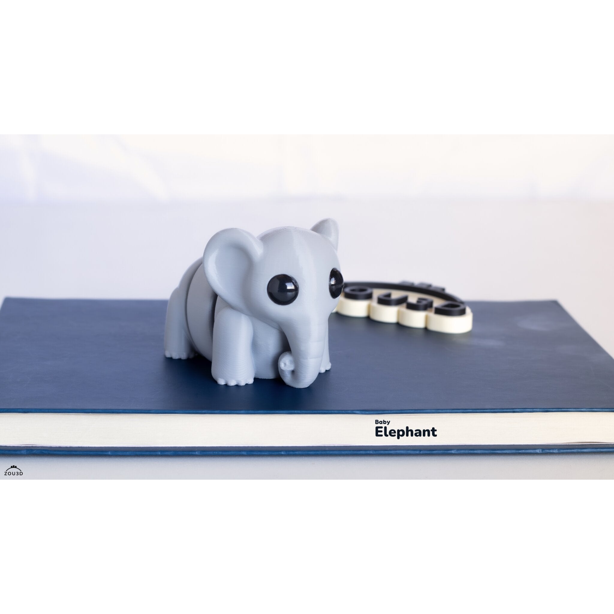 Baby Elephant ZOU3D articulated 3D printed toy — side and rear 3/4 view
