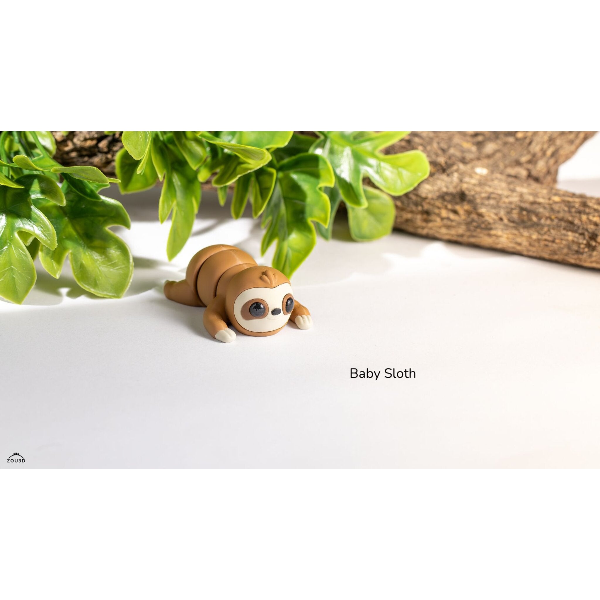 Baby Sloth 3D printed articulated toy — straight-on front view showing big eyes and cream face mask