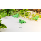 Baby Iguana (ZOU3D) — three articulated figures with foliage backdrop, official render
