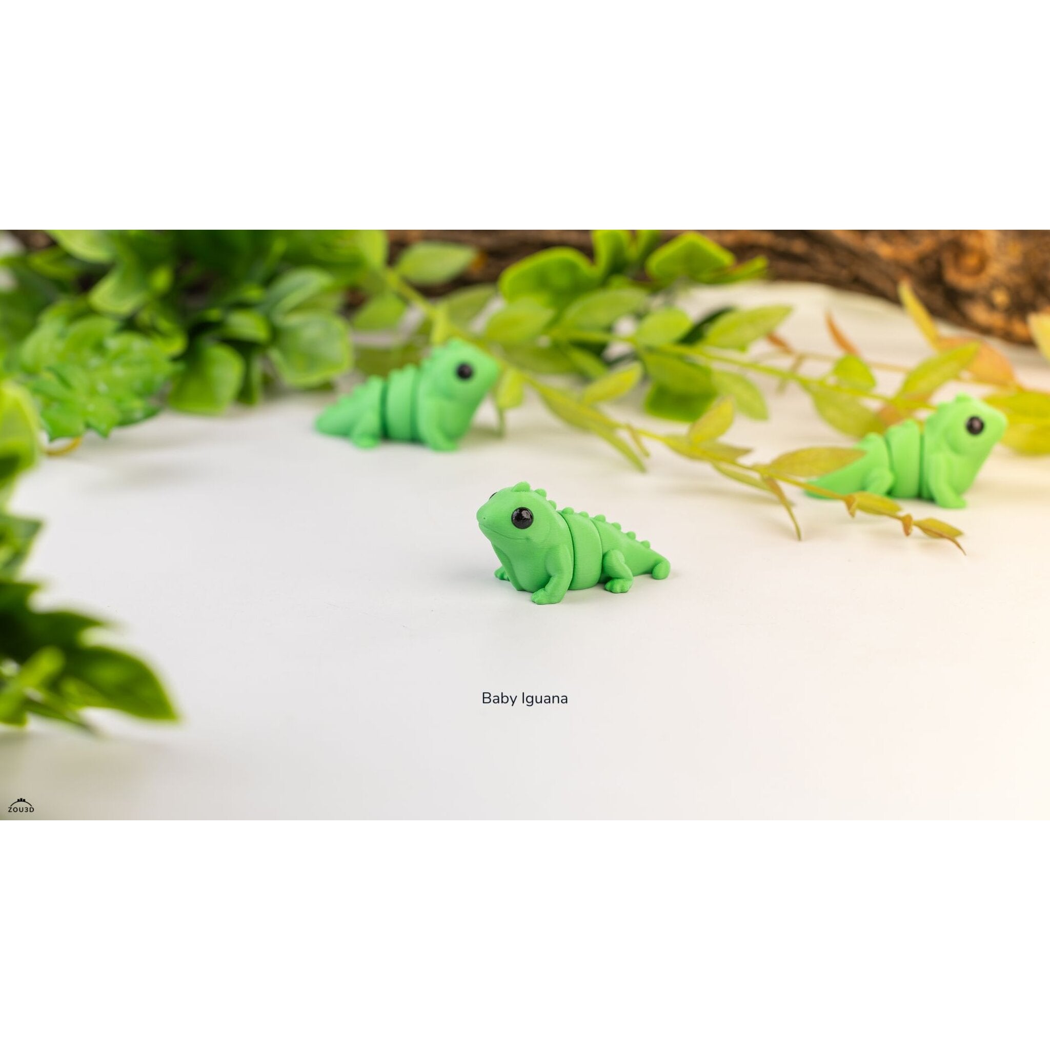 Baby Iguana (ZOU3D) — three articulated figures with foliage backdrop, official render