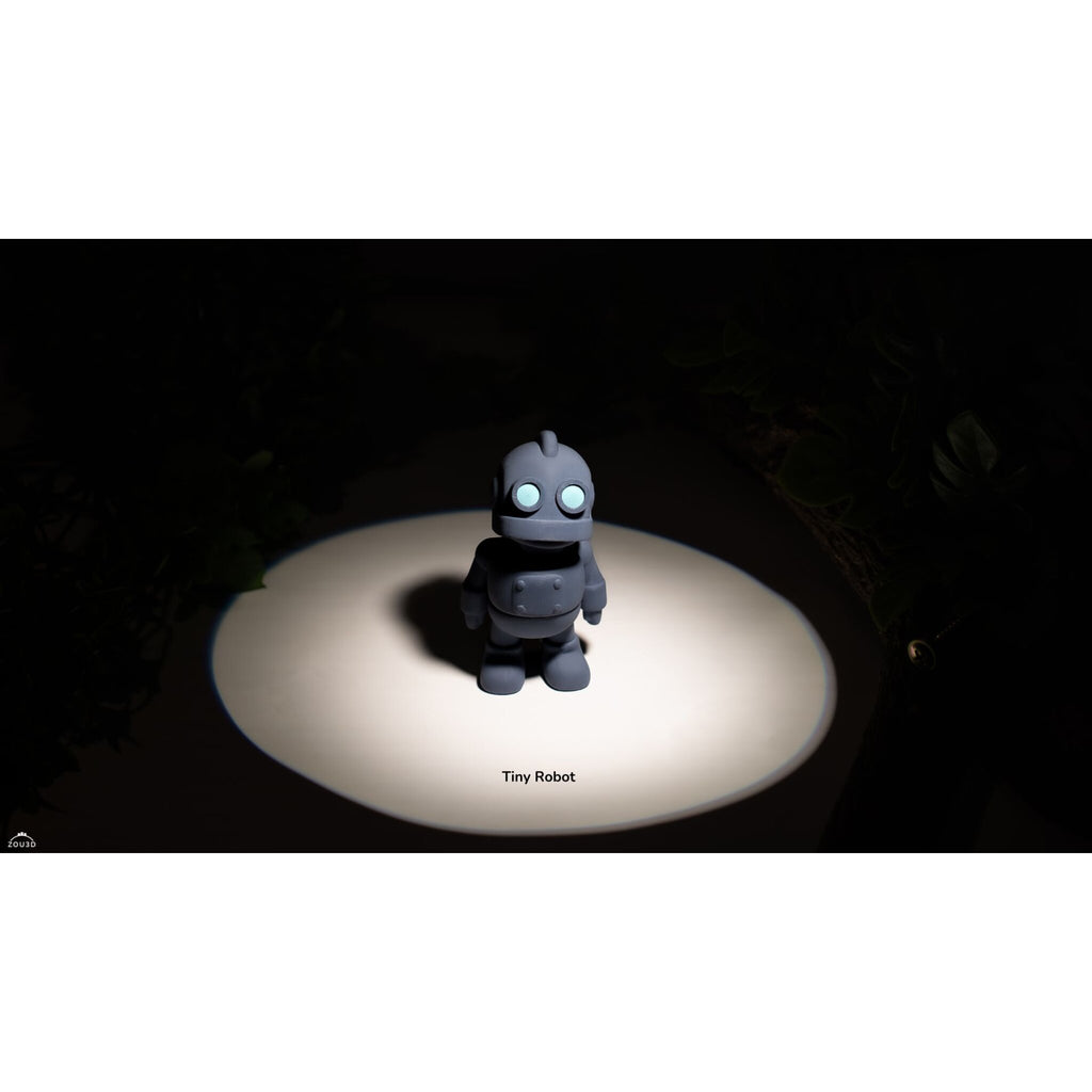 Zou3D render of Tiny Robot articulated fidget toy in grey/slate — slight angle showing body depth