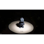 Zou3D render of Tiny Robot articulated fidget toy in grey/slate — slight angle showing body depth