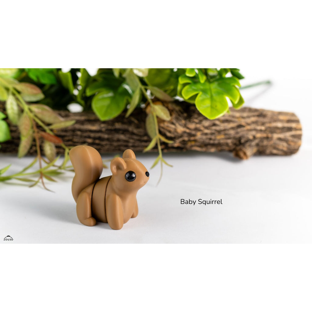 Baby Squirrel Zou3D articulated fidget toy, front-right three-quarter view showing segmented body and sculptured arching tail