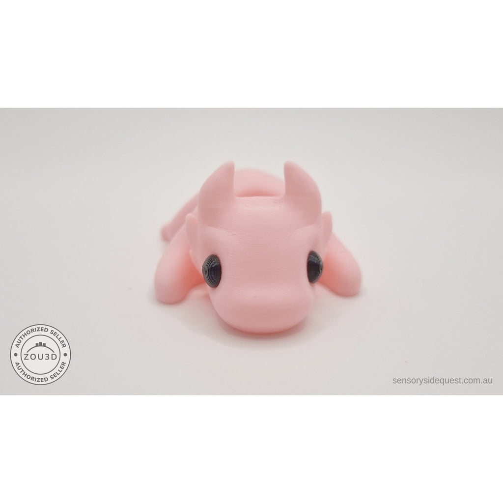 Pink Tiny Dragon 3D printed fidget toy — 3/4 front view showing horns and expressive eyes — Sensory Sidequest Australia
