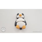 Penguin articulated fidget toy front 3/4 view standing upright, white body with black head and orange beak and feet — 3D printed articulated fidget toy by Sensory Sidequest