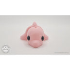 Pink Baby Dolphin 3D printed articulated fidget toy — 3/4 front view showing face and body segments — Sensory Sidequest Australia