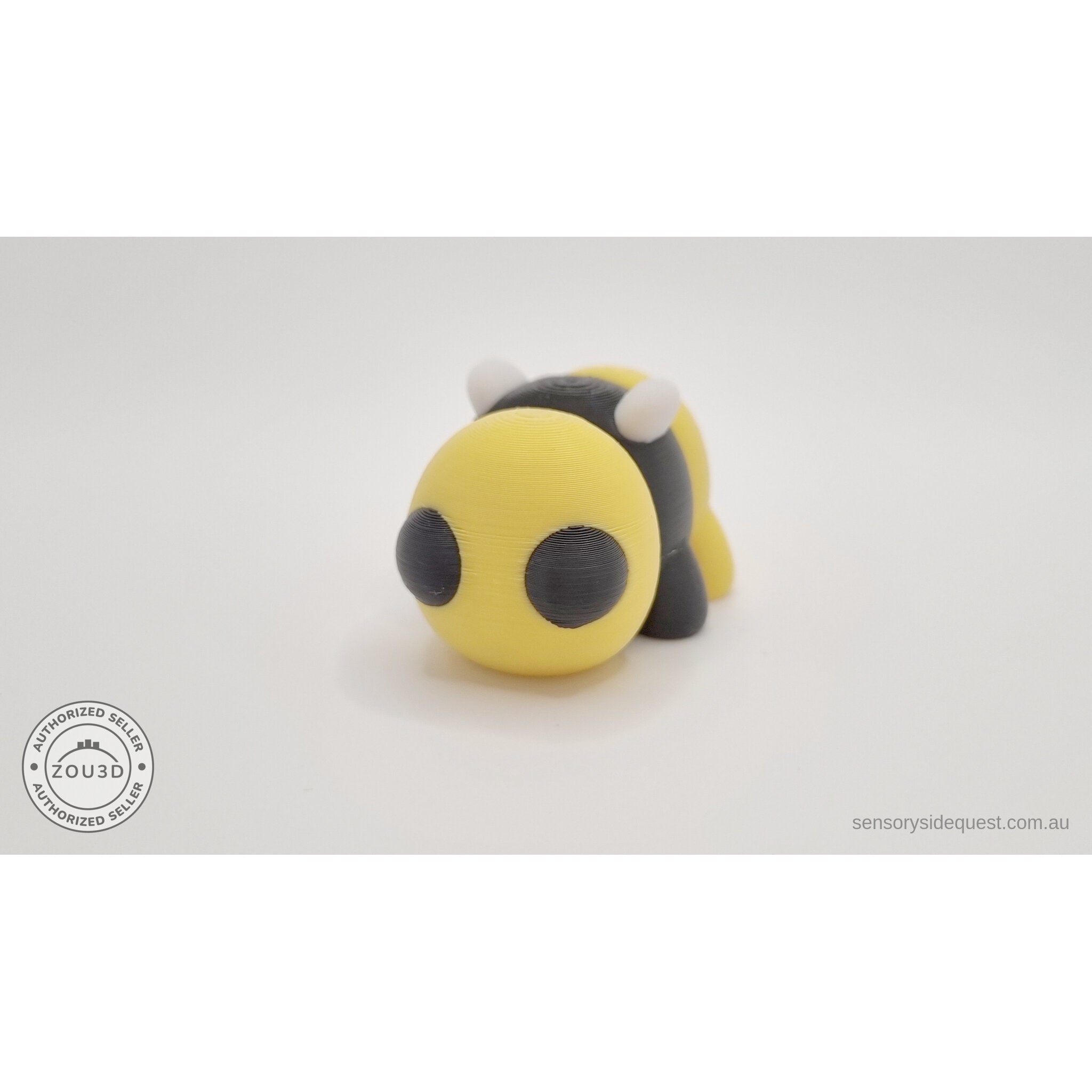 Baby Bee articulated fidget toy — front-facing view showing large expressive eyes and yellow body
