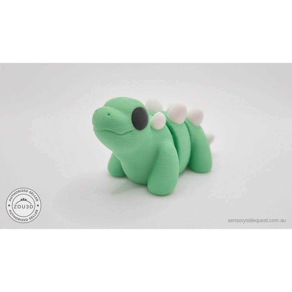 Baby Stegosaurus articulated fidget toy — three-quarter front view showing back plates and eye