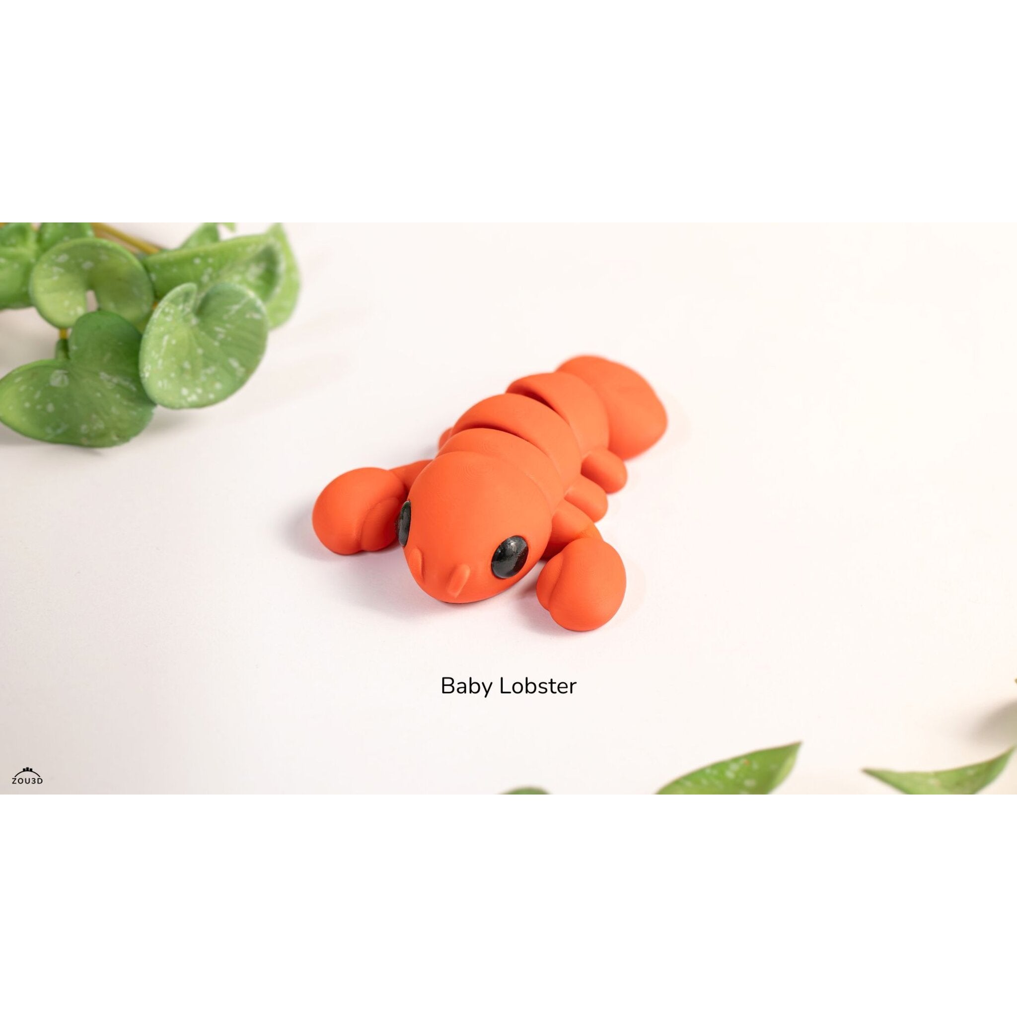 Baby Lobster articulated fidget toy — official Zou3D render, front 3/4 view with plant lifestyle props, orange colourway