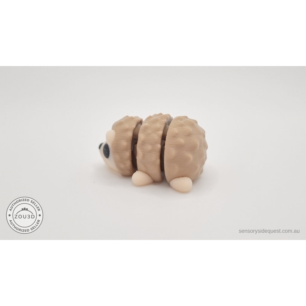 Baby Hedgehog articulated fidget toy — left side profile view showing body shape and quill segments, own photo by Sensory Sidequest