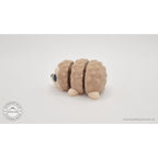 Baby Hedgehog articulated fidget toy — left side profile view showing body shape and quill segments, own photo by Sensory Sidequest