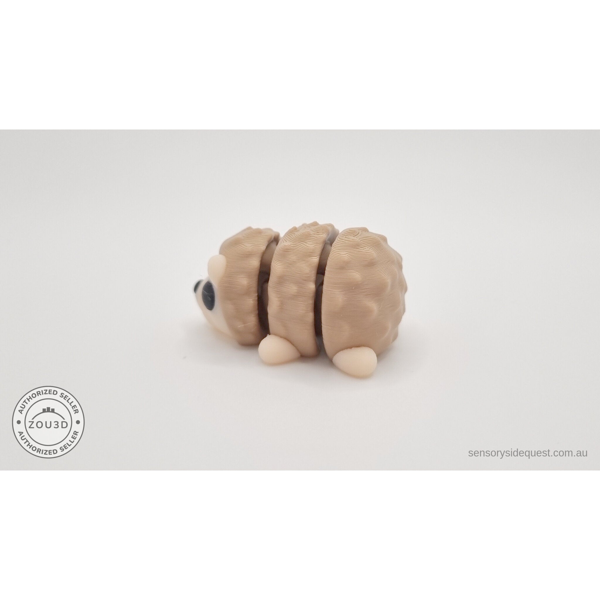 Baby Hedgehog articulated fidget toy — left side profile view showing body shape and quill segments, own photo by Sensory Sidequest