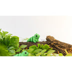 Baby Iguana (ZOU3D) — single figure perched on log, official lifestyle render