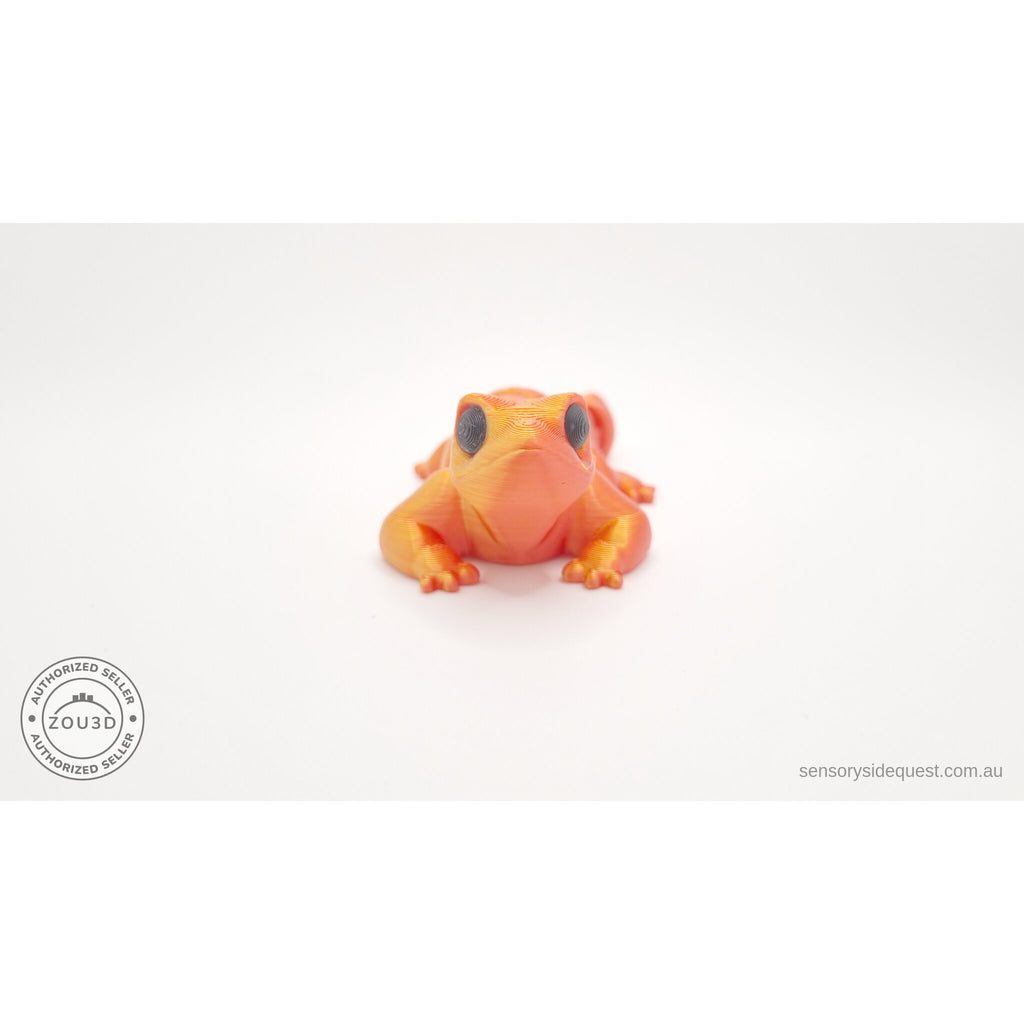 Red-gold Baby Lizard 3D printed articulated fidget toy — straight front face-on view showing chibi eyes — Sensory Sidequest