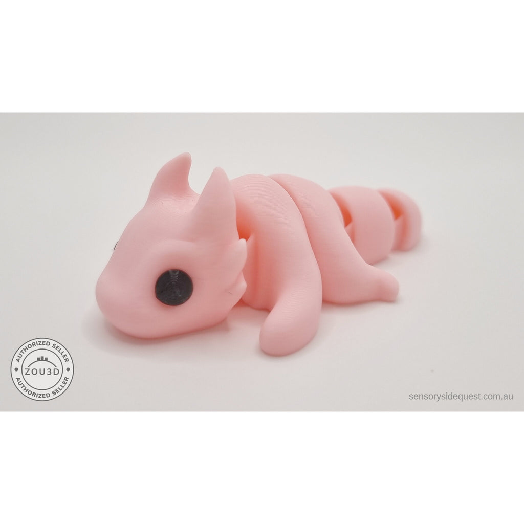 Pink Tiny Dragon articulated fidget toy — left side full-body view showing segmented tail — Sensory Sidequest Australia
