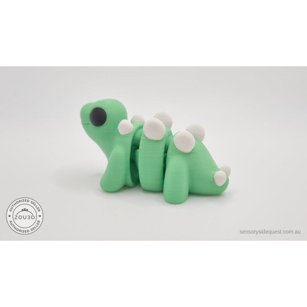 Baby Stegosaurus — side profile view showing full body length, back plates, and tail