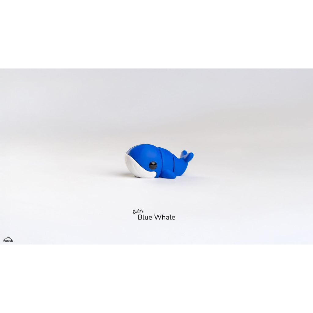 Side view of Baby Blue Whale articulated fidget toy showing body segments and tail flukes raised, demonstrating articulation joints