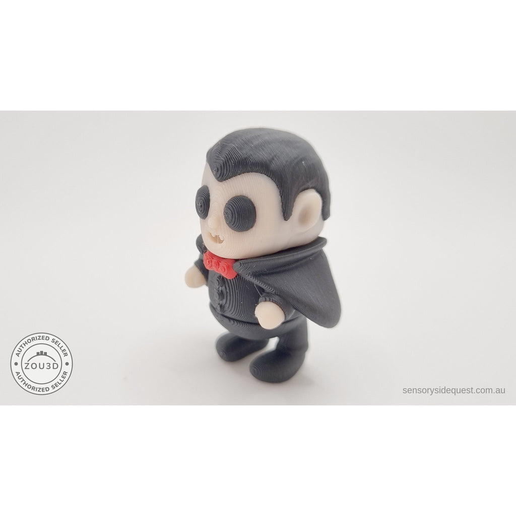 Tiny Dracula articulated toy — 3/4 left view showing cape sweep and figure detail, own photo by Sensory Sidequest