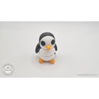 Penguin articulated fidget toy overhead flat lay showing front face, white body with black head markings and orange beak — 3D printed articulated fidget toy by Sensory Sidequest