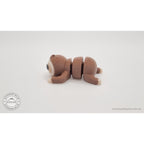 Baby Sloth articulated toy — left side profile view showing body segments and arm detail, own photo by Sensory Sidequest