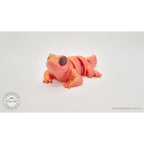 Red-gold Baby Lizard 3D printed articulated fidget toy — side profile showing segmented body and four legs — Sensory Sidequest