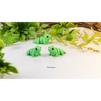 Baby Iguana (ZOU3D) — two figures close-up front-facing, official render