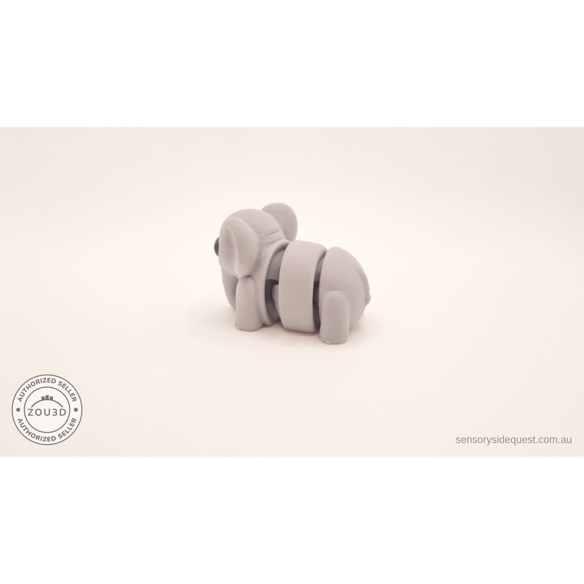 Grey Baby Elephant 3D printed articulated toy — rear view showing flexible body joints