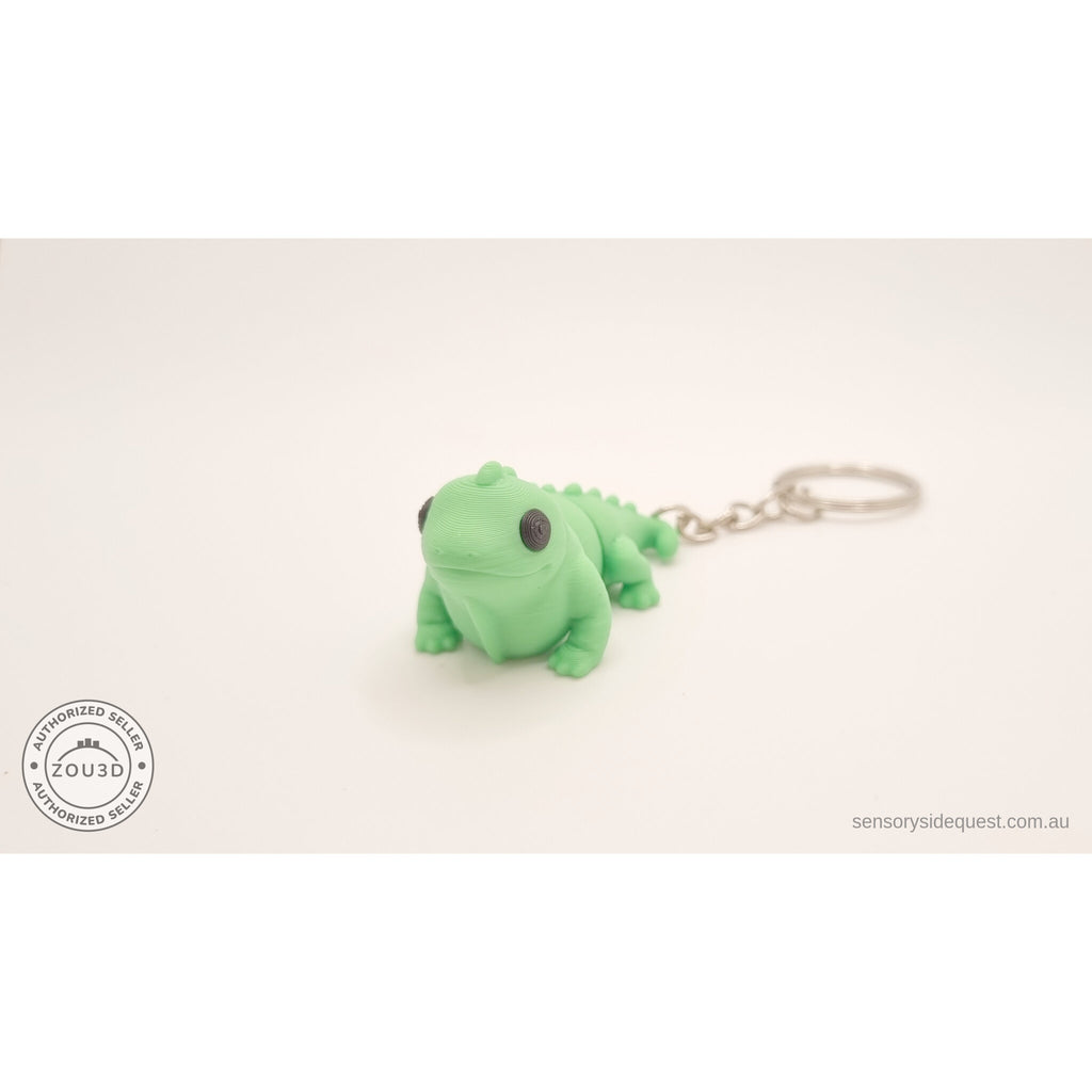 Green Baby Iguana 3D printed articulated fidget toy keychain — 3/4 front view by Sensory Sidequest