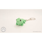 Green Baby Iguana 3D printed articulated fidget toy keychain — 3/4 front view by Sensory Sidequest