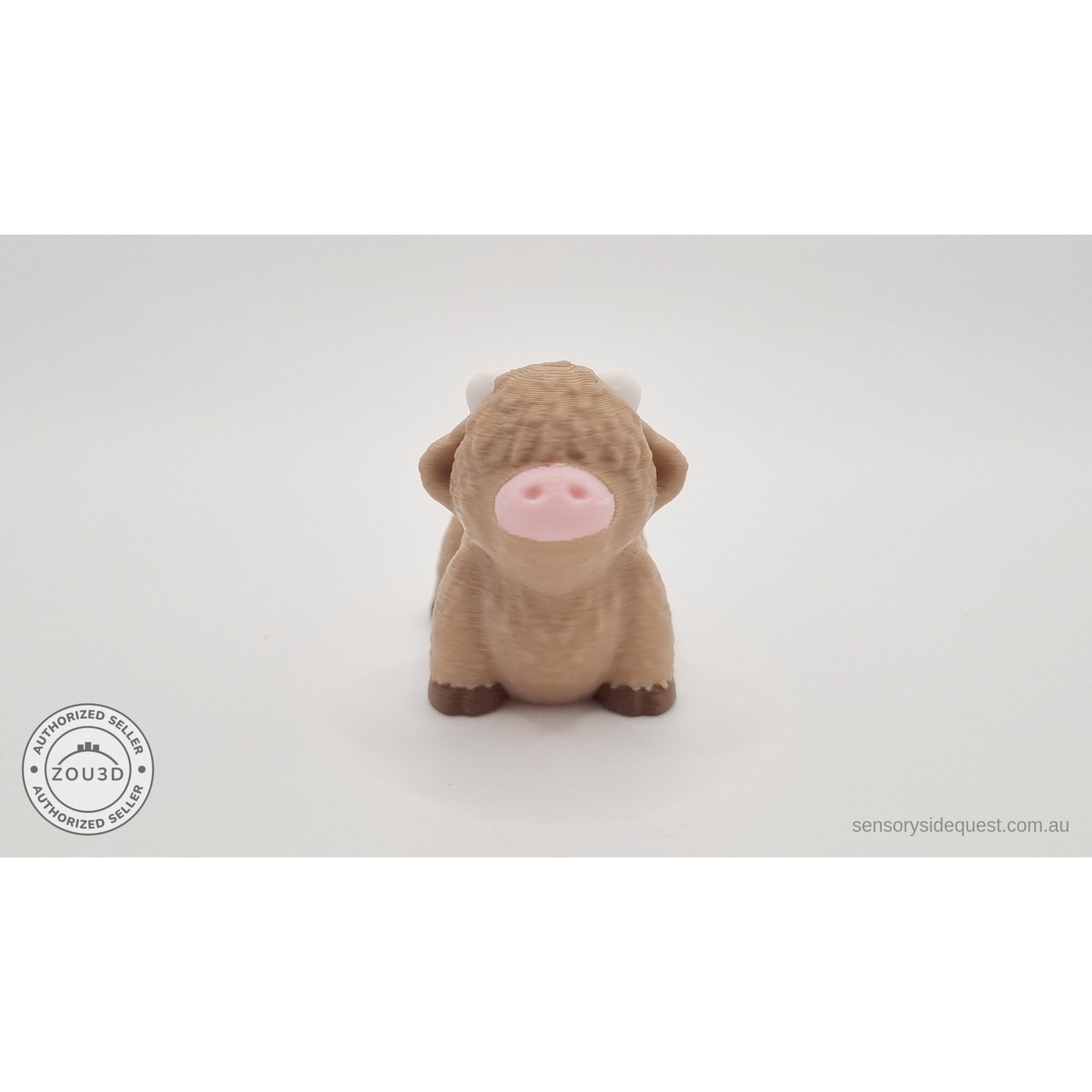 Baby Highland Cow 3D printed articulated fidget toy — three-quarter side view showing body segments stretched in articulated pose — Sensory Sidequest