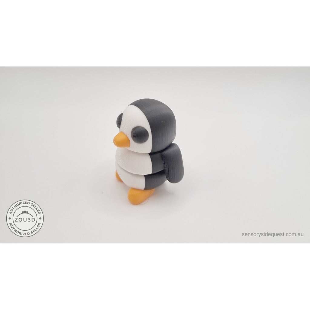 Penguin articulated fidget toy overhead flat lay showing white belly and back, black wings and orange feet visible — 3D printed articulated fidget toy by Sensory Sidequest