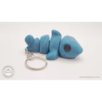027-TNYSHK Tiny Shark keychain in gentian blue — rear view showing tail segment and keychain chain attachment point — 3D printed articulated fidget toy by Sensory Sidequest
